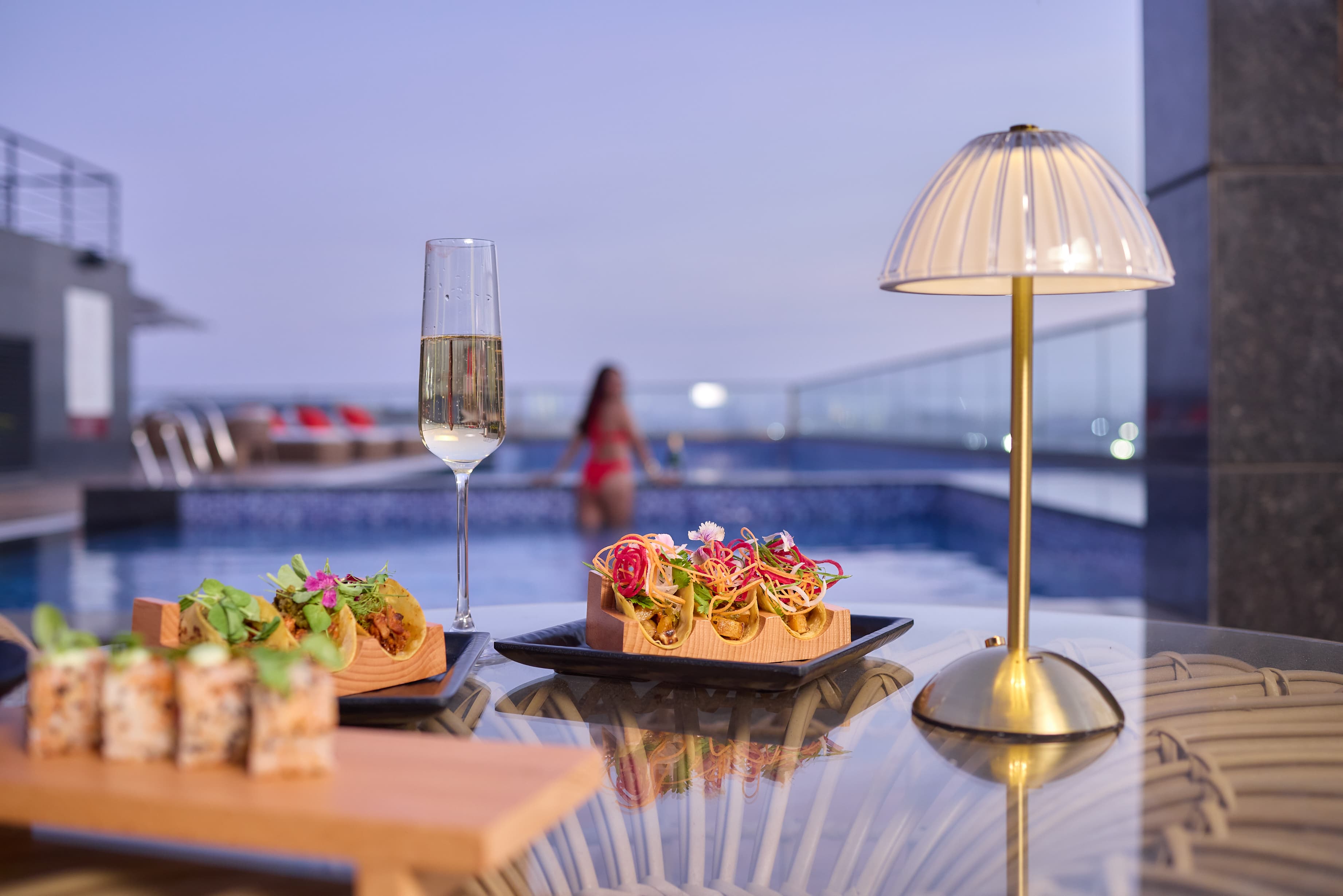DINNER BY THE POOL. ON US.